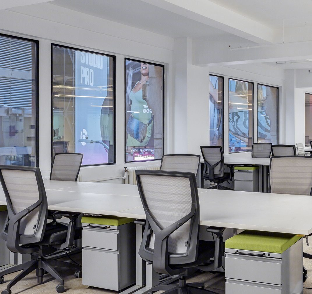 Workstations beneath oversized windows